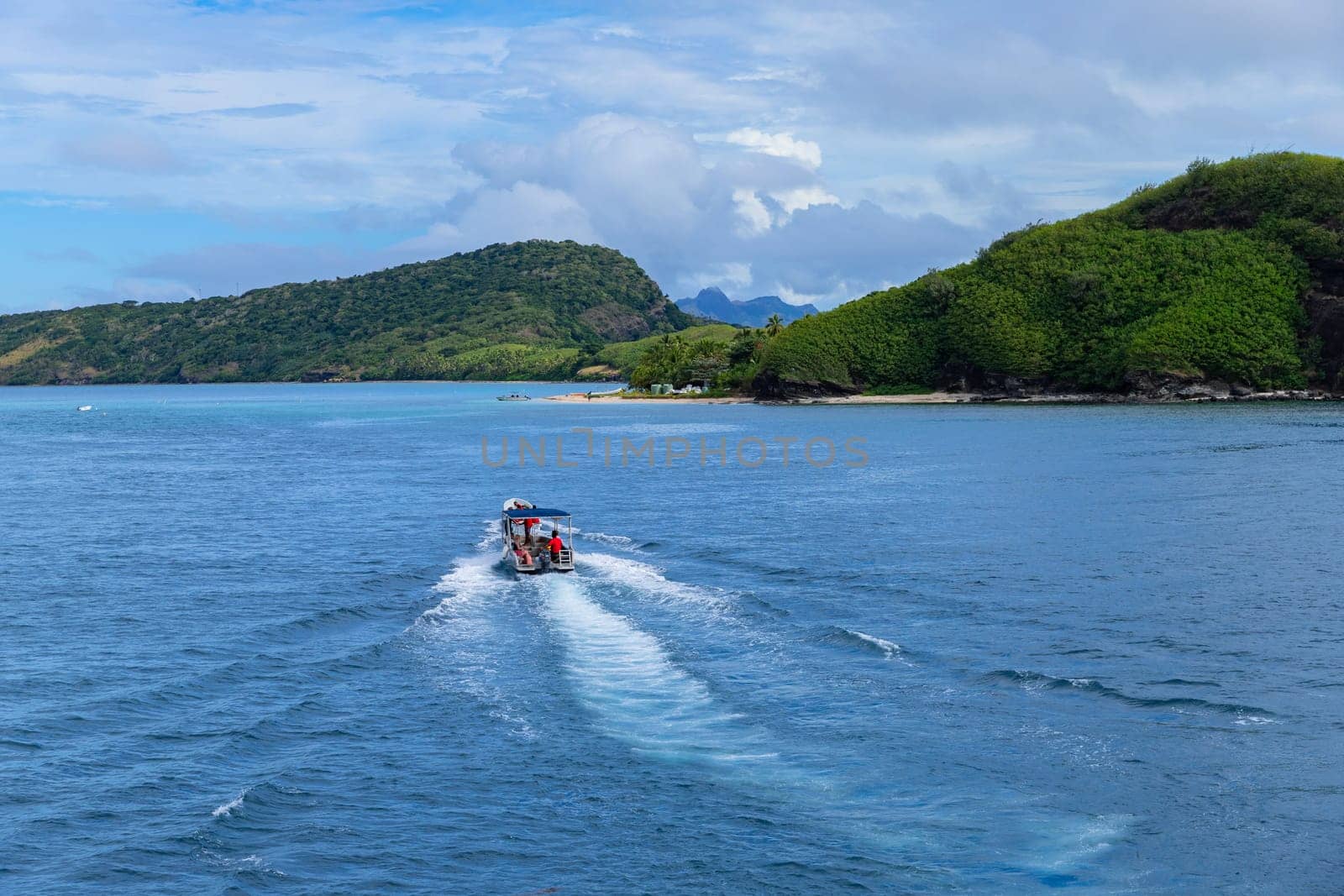 Nacula Fiji: June 25 2023: Group of tourists on a ship in the coast Nacula island, Yasawa islands, Fiji, South Pacific Islands, Pacific