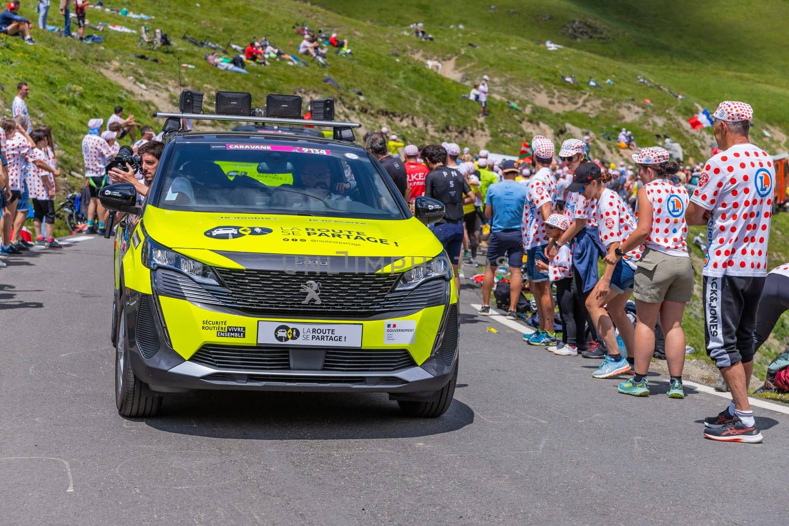 Col du Tourmalet, France - July 06 2023: Caravan car at the top of the Col du Tourmalet in Pyerenees mountains during the stage 6 of Le Tour de France 2023
