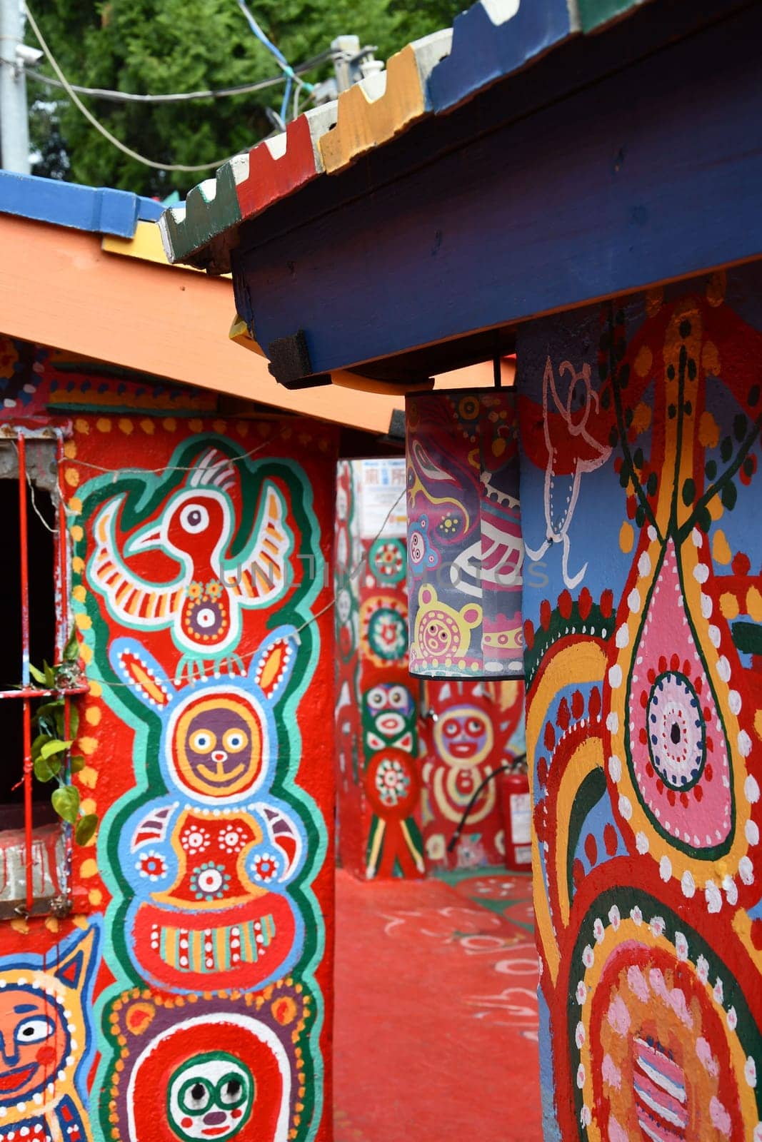 Houses with colorful interesting cartoon paintings on the walls in Caihong, Taichung, Taiwan