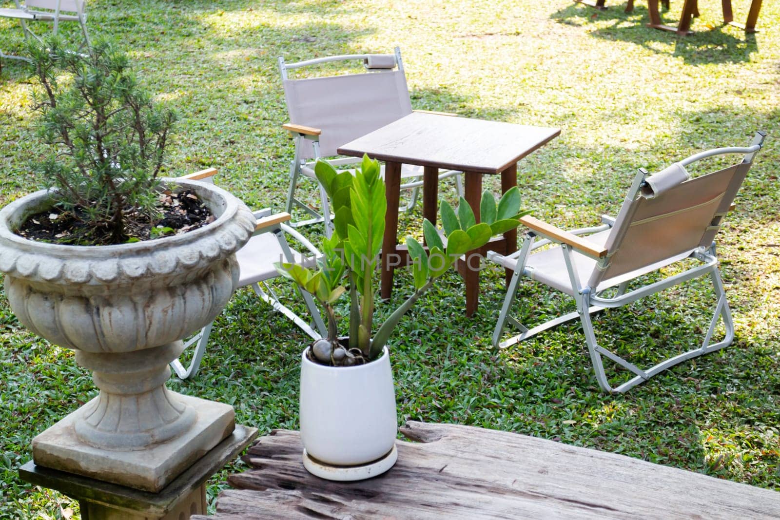 Outdoors seats in coffee shop garden, stock photo