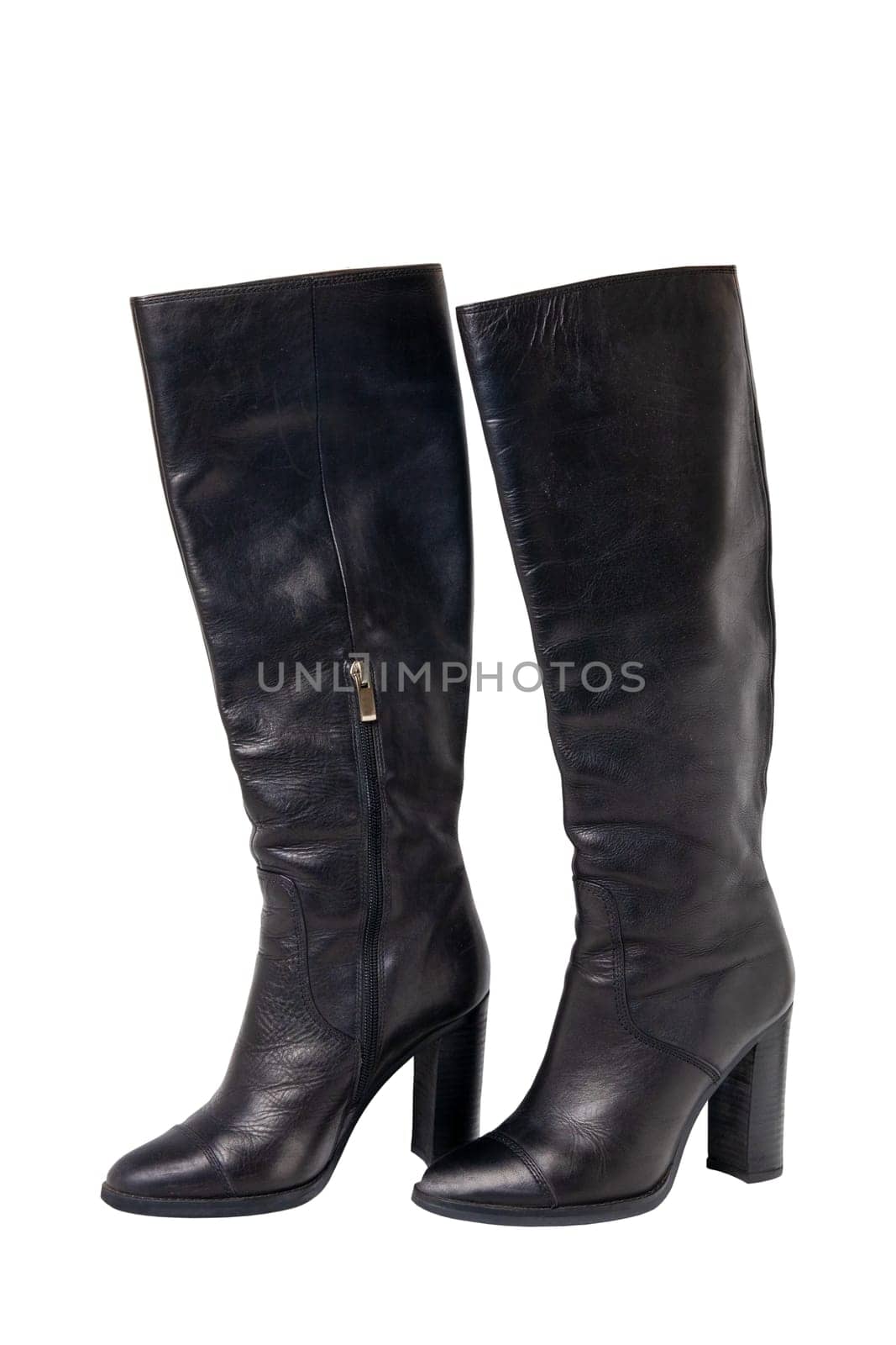 A pair of black elegant female boots or woman shoes isolated on a white background. Leather boots. Clipping path.