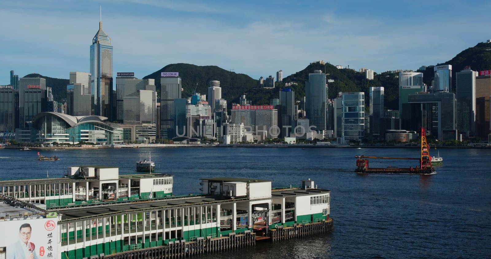 Victoria Harbor, Hong Kong 01 July 2020 : Hong Kong city with pier dock