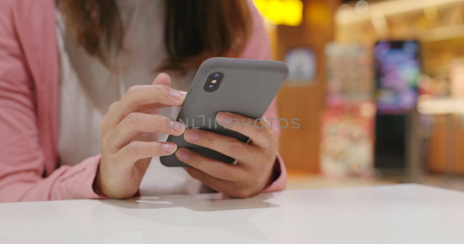 Woman use of smart phone at restaurant
