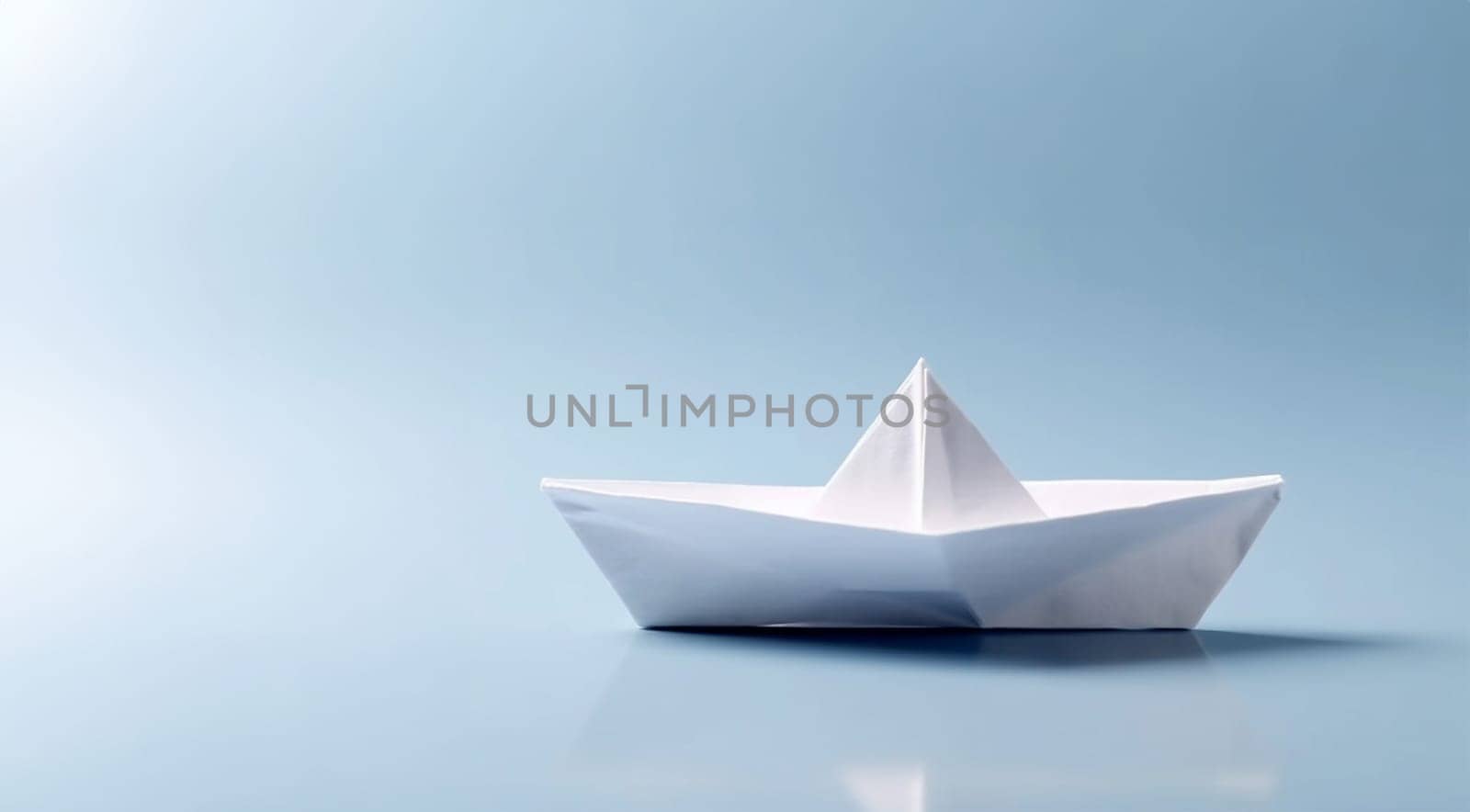 Creative image of white origami ships placed behind blue and orange paper ship representing concept of leadership on light background Copy space. Business concept design. Space for text