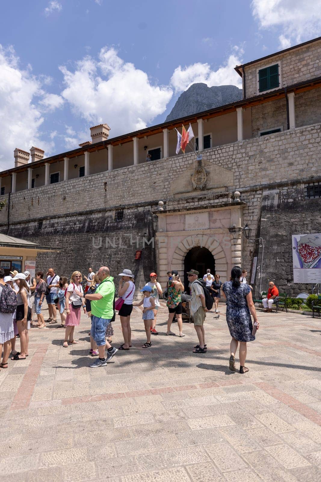 Kotor, Montenegro - June 26, 2023: View of medieval Sea Gate (Main Gate), main entrance to Old Town surrounded by Old City Walls