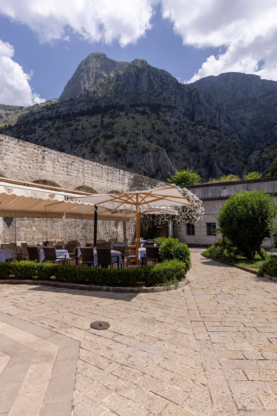 Kotor, Montenegro - June 26, 2023: View of Wood square by Old City Walls with River Gate (North Gate)