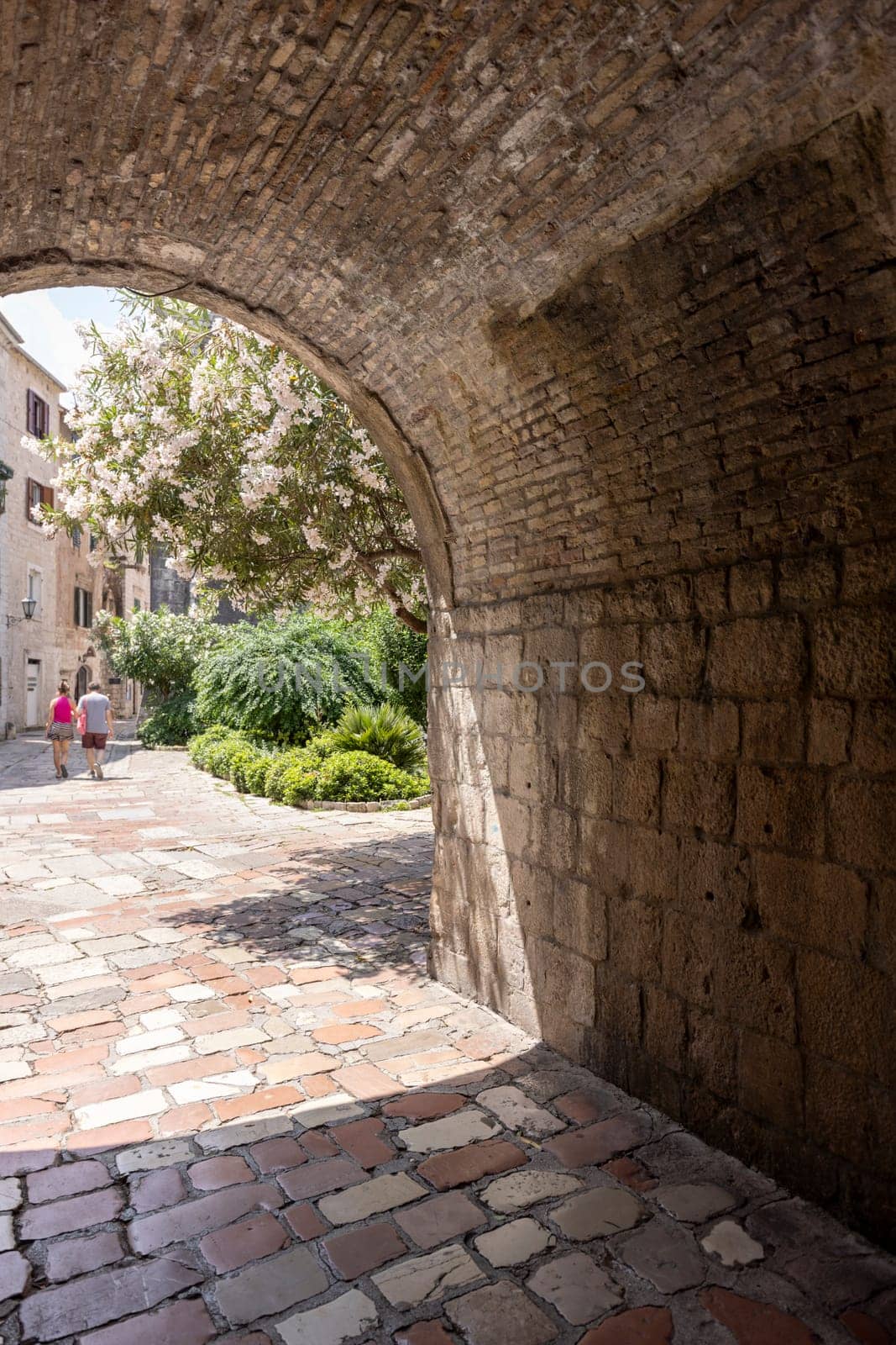 Kotor, Montenegro - June 26, 2023: View of River Gate (North Gate), entrance to Old Town and Wood square by Old City Walls