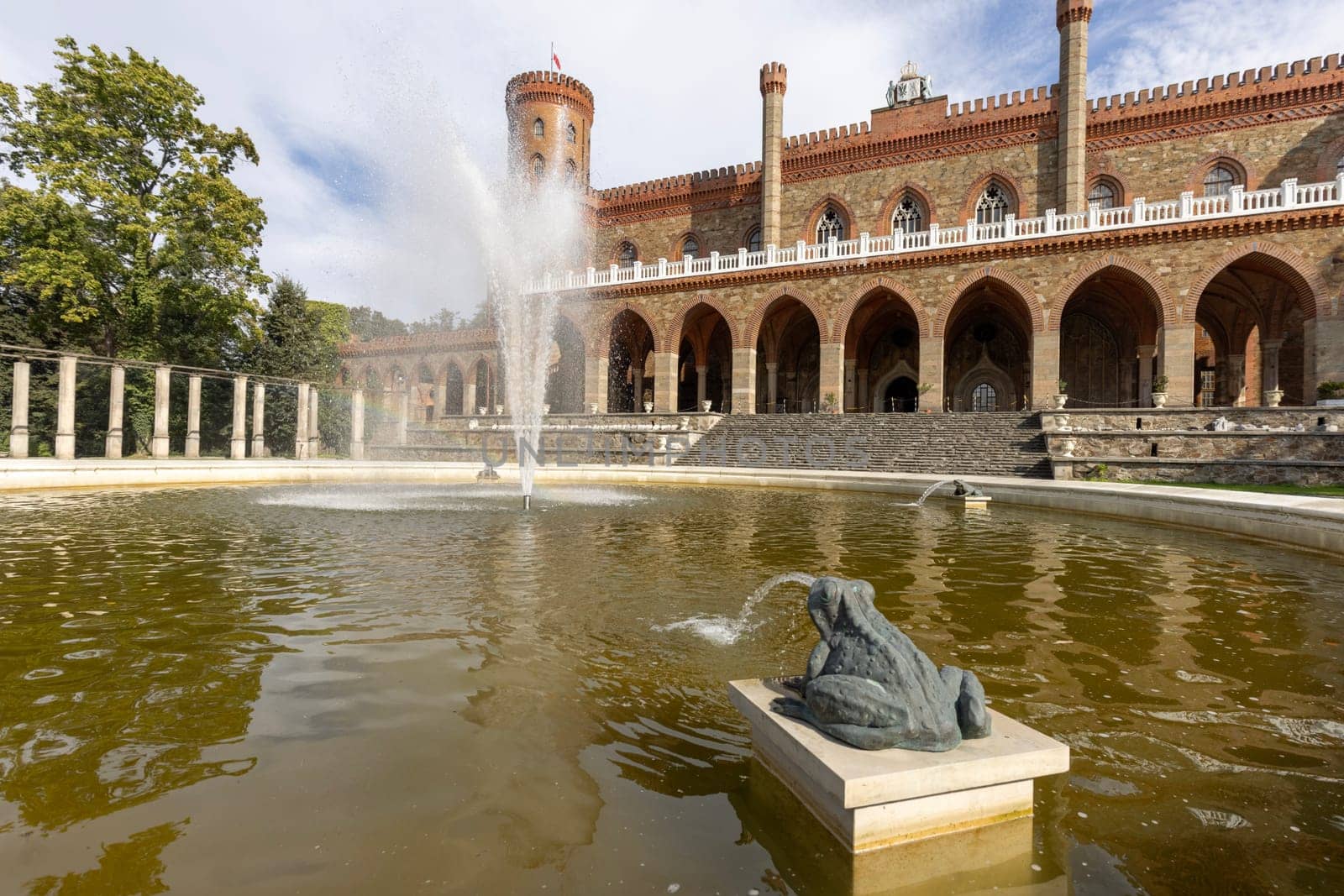 Kamieniec Zabkowicki, Poland - October 2, 2021: Kamieniec Zabkowicki Palace, 19th-century monumental palace located in a village in the Lower Silesian Voivodeship. Fountain in front of the main entrance