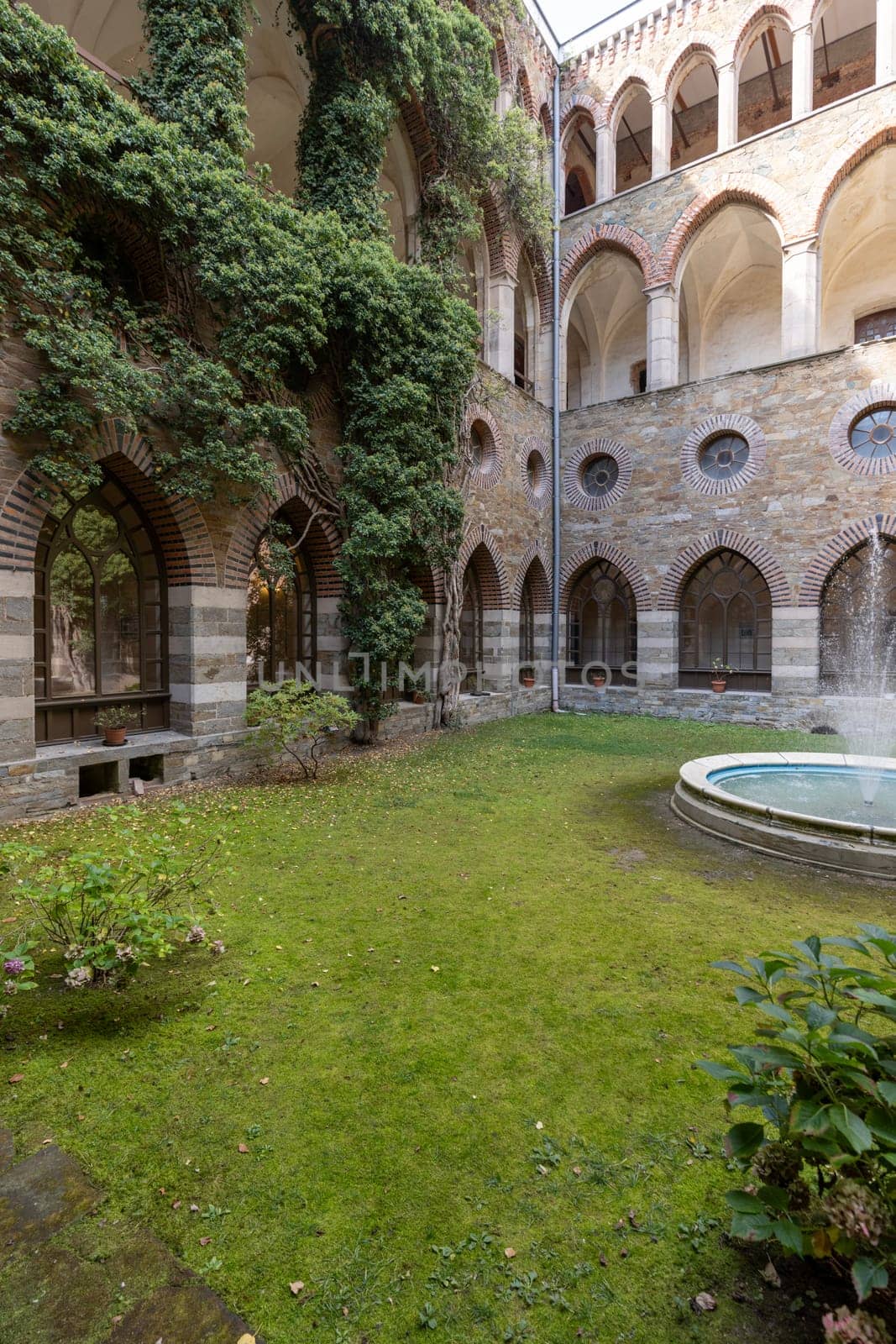 Kamieniec Zabkowicki, Poland - October 2, 2021: Kamieniec Zabkowicki Palace, 19th-century monumental palace located in a village in the Lower Silesian Voivodeship. Cloistered Courtyard  with fountain