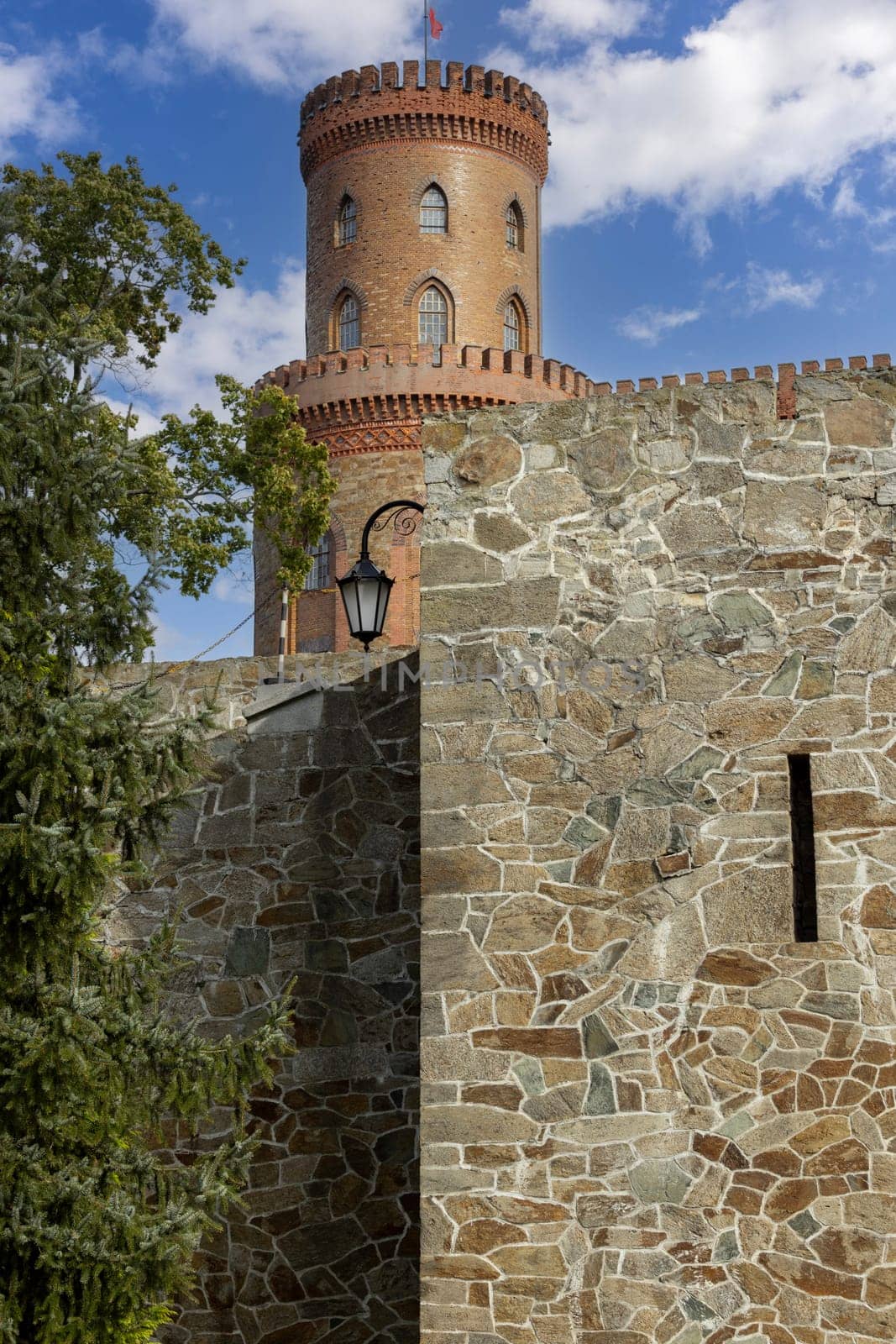 Kamieniec Zabkowicki, Poland - October 2, 2021: Kamieniec Zabkowicki Palace, 19th-century palace located in a village in the Lower Silesian Voivodeship. Fragment of the wall surrounding the building