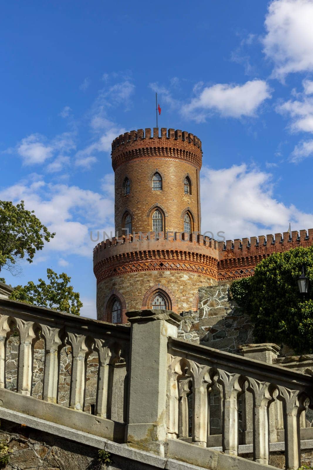 Kamieniec Zabkowicki, Poland - October 2, 2021: Kamieniec Zabkowicki Palace, 19th-century palace located in a village in the Lower Silesian Voivodeship. Fragment of the wall surrounding the building