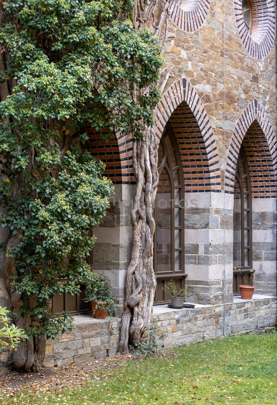 Kamieniec Zabkowicki, Poland - October 2, 2021: Kamieniec Zabkowicki Palace, 19th-century monumental palace located in a village in the Lower Silesian Voivodeship. Cloistered Courtyard  with fountain