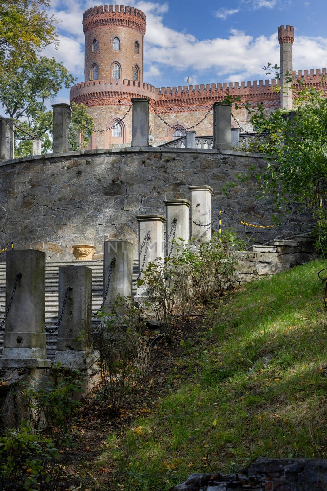 Kamieniec Zabkowicki, Poland - October 2, 2021: Kamieniec Zabkowicki Palace, 19th-century palace located in a village in the Lower Silesian Voivodeship. Fragment of the wall surrounding the building