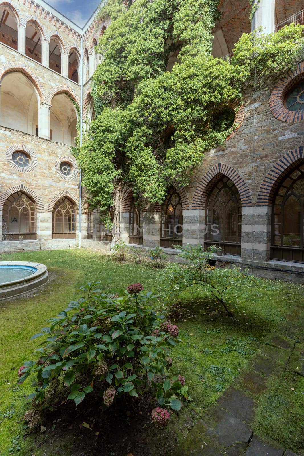 Kamieniec Zabkowicki, Poland - October 2, 2021: Kamieniec Zabkowicki Palace, 19th-century monumental palace located in a village in the Lower Silesian Voivodeship. Cloistered Courtyard  with fountain