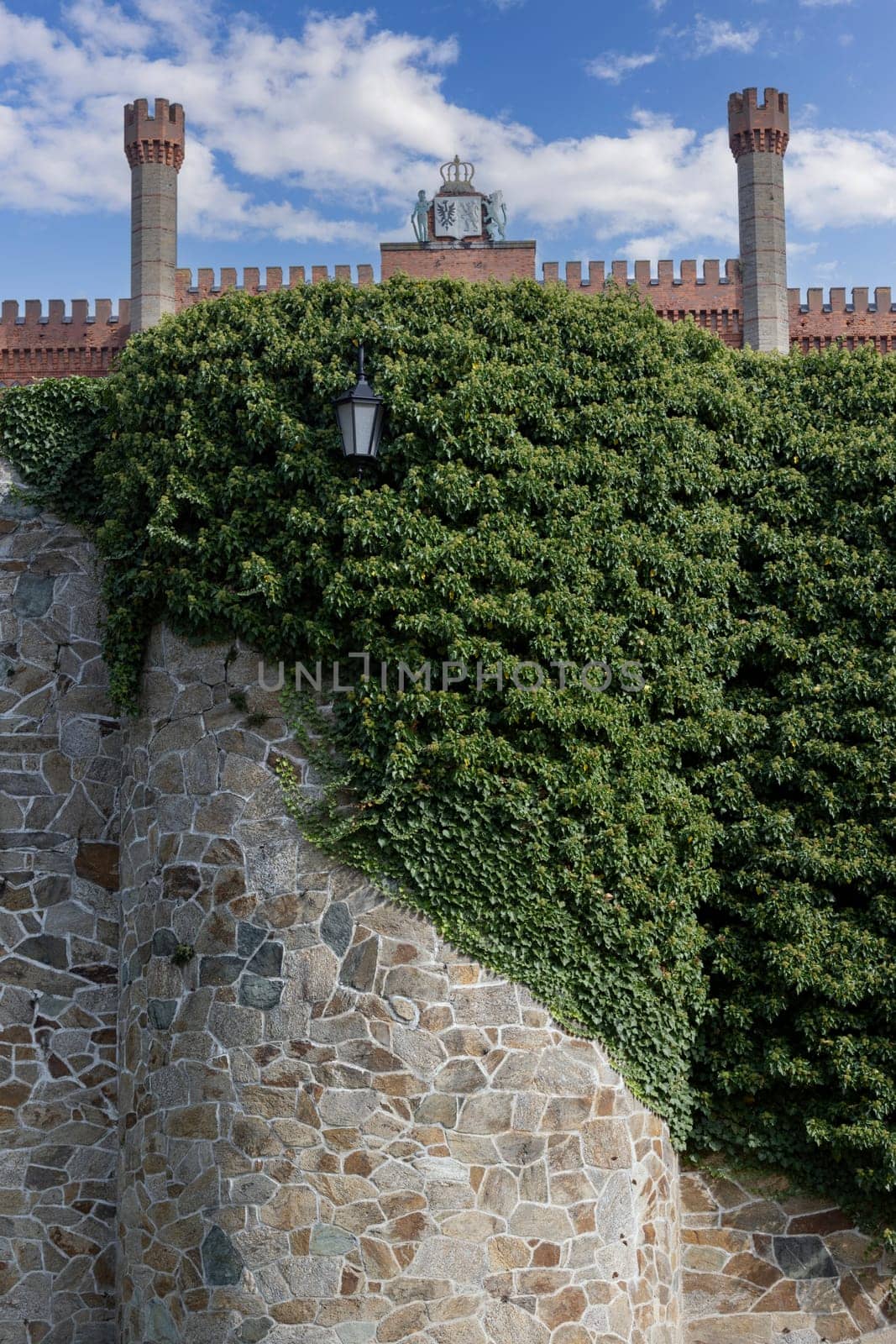 Kamieniec Zabkowicki, Poland - October 2, 2021: Kamieniec Zabkowicki Palace, 19th-century palace located in a village in the Lower Silesian Voivodeship. Fragment of the wall surrounding the building