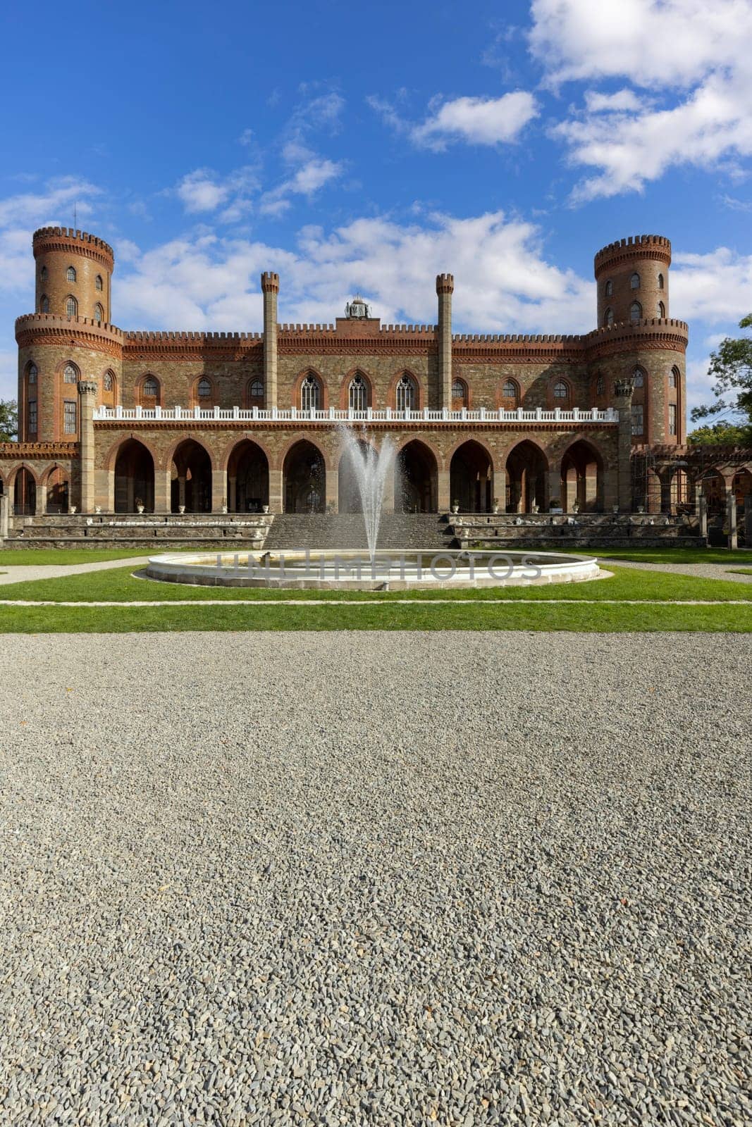 Kamieniec Zabkowicki, Poland - October 2, 2021: Kamieniec Zabkowicki Palace, 19th-century monumental palace located in a village in the Lower Silesian Voivodeship. Fountain in front of the main entrance
