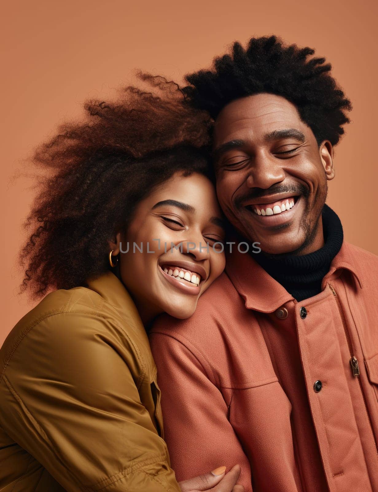 two black Americans hugging and smiling on a brown background.