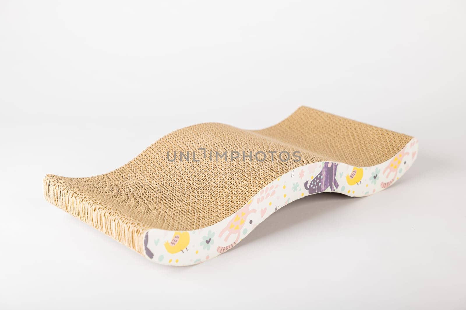 White background illuminates modern abstract cat scratching post dual-purpose piece with corrugated cardboard design. cat playful paw and alertness are what make this feline furniture a must-have.