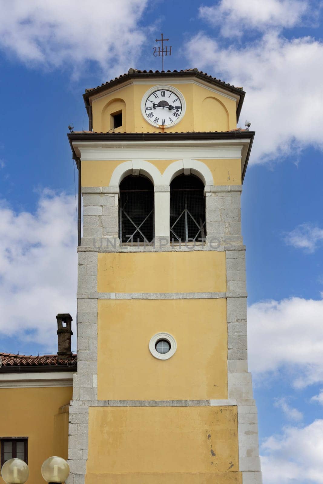 Rijeka, Croatia - September 23, 2023: Freestanding clock tower of baroque St. Vitus Cathedral (Katedrala sv. Vida) also known as Rijeka Cathedral