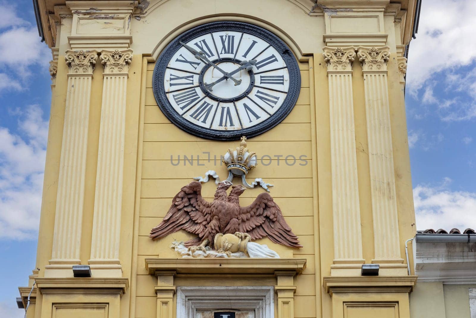 Rijeka, Croatia - September 23, 2023: Medieval baroque city clock tower ( Gradska ura) by Korzo promenade, main steet in the city. The tower is located above the city gate