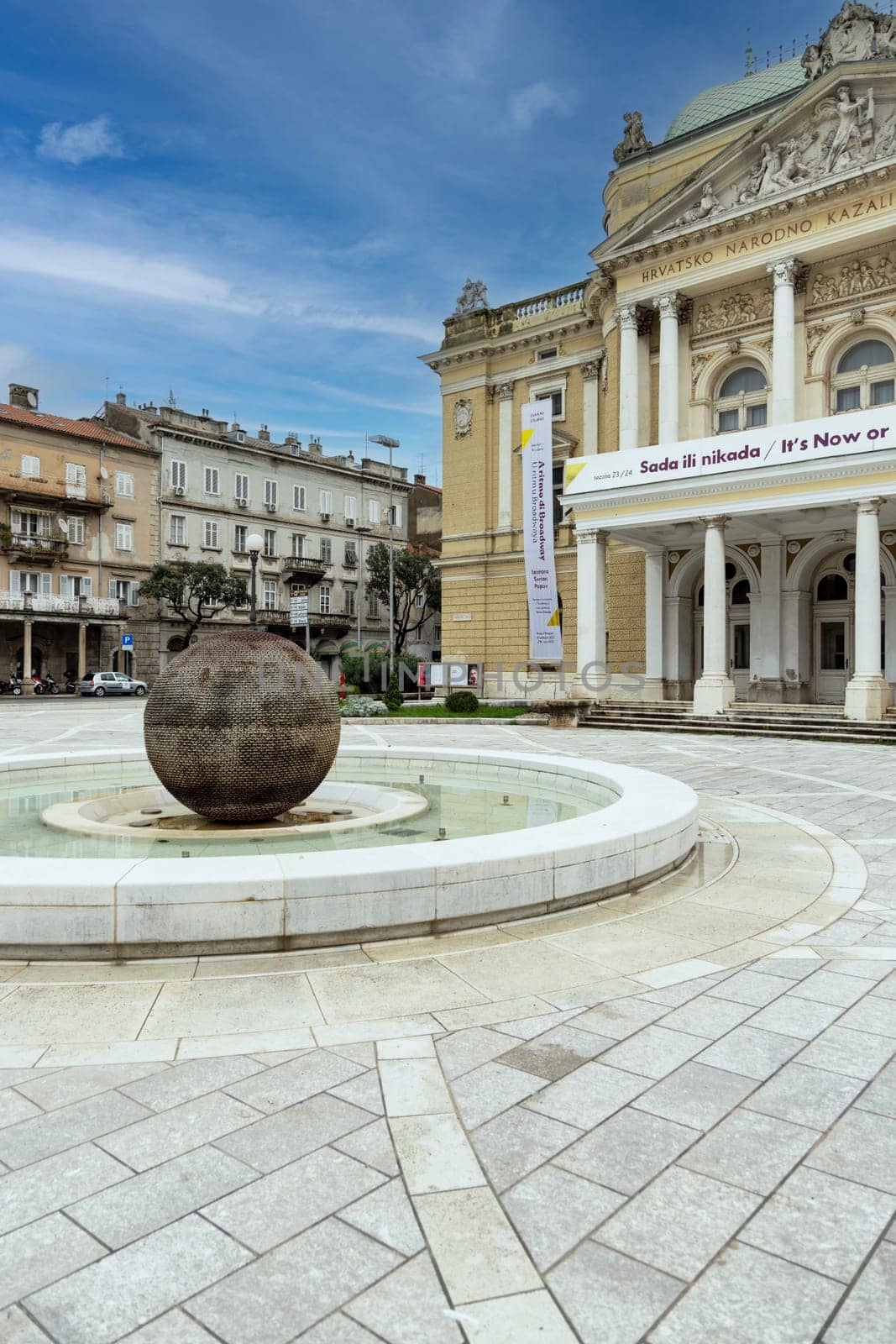 Rijeka, Croatia - September 23, 2023: Decorative building of Ivan Zajc Croatian National Theatre and Fountain of Ivan Zajc (Fontana Ivana Zajca) at classicist-art nouveau style Theatre Park