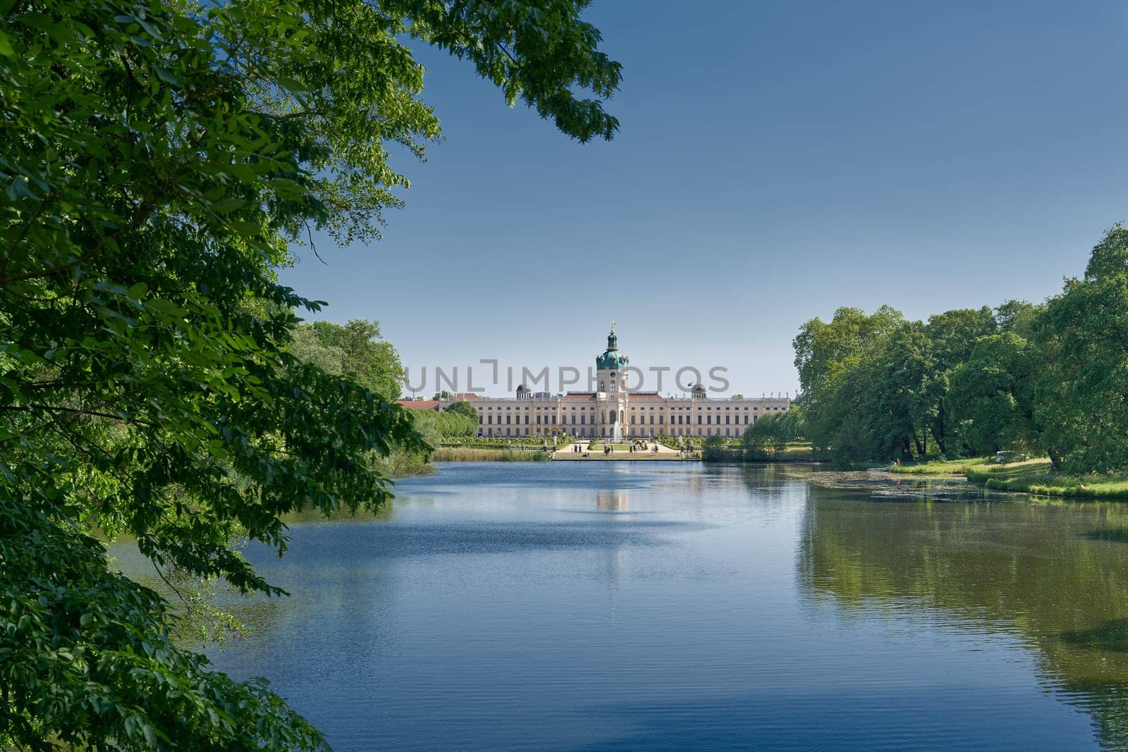 Charlottenburg Palace in Berlin seen from a public footpath by the carp pond