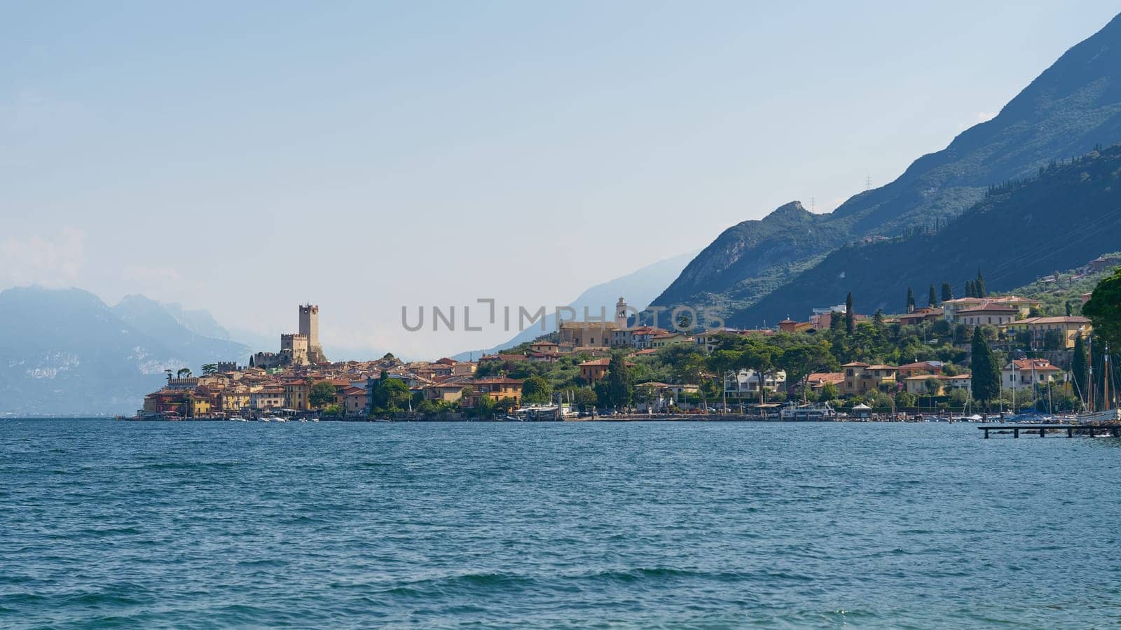 Panoramic view of the medieval town of Malcesine on Lake Garda in Italy seen from the water