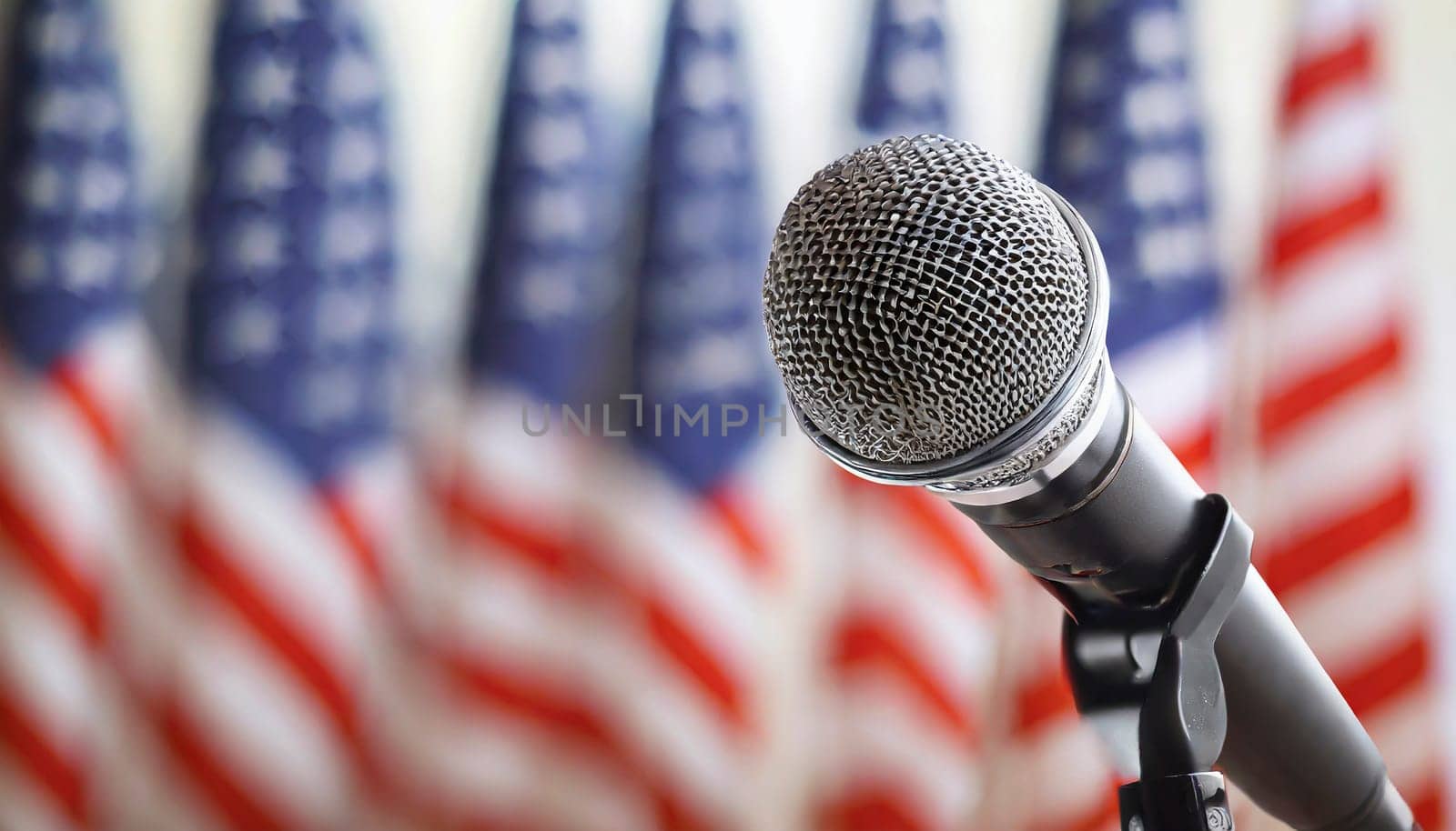Microphone on a blurred background of the American flags. AI generated