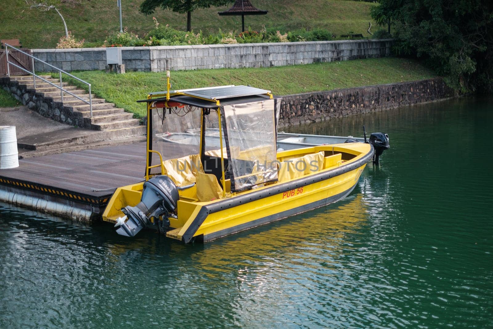 Singapore - September 7 2023: Yellow Patrol Boat at Platform