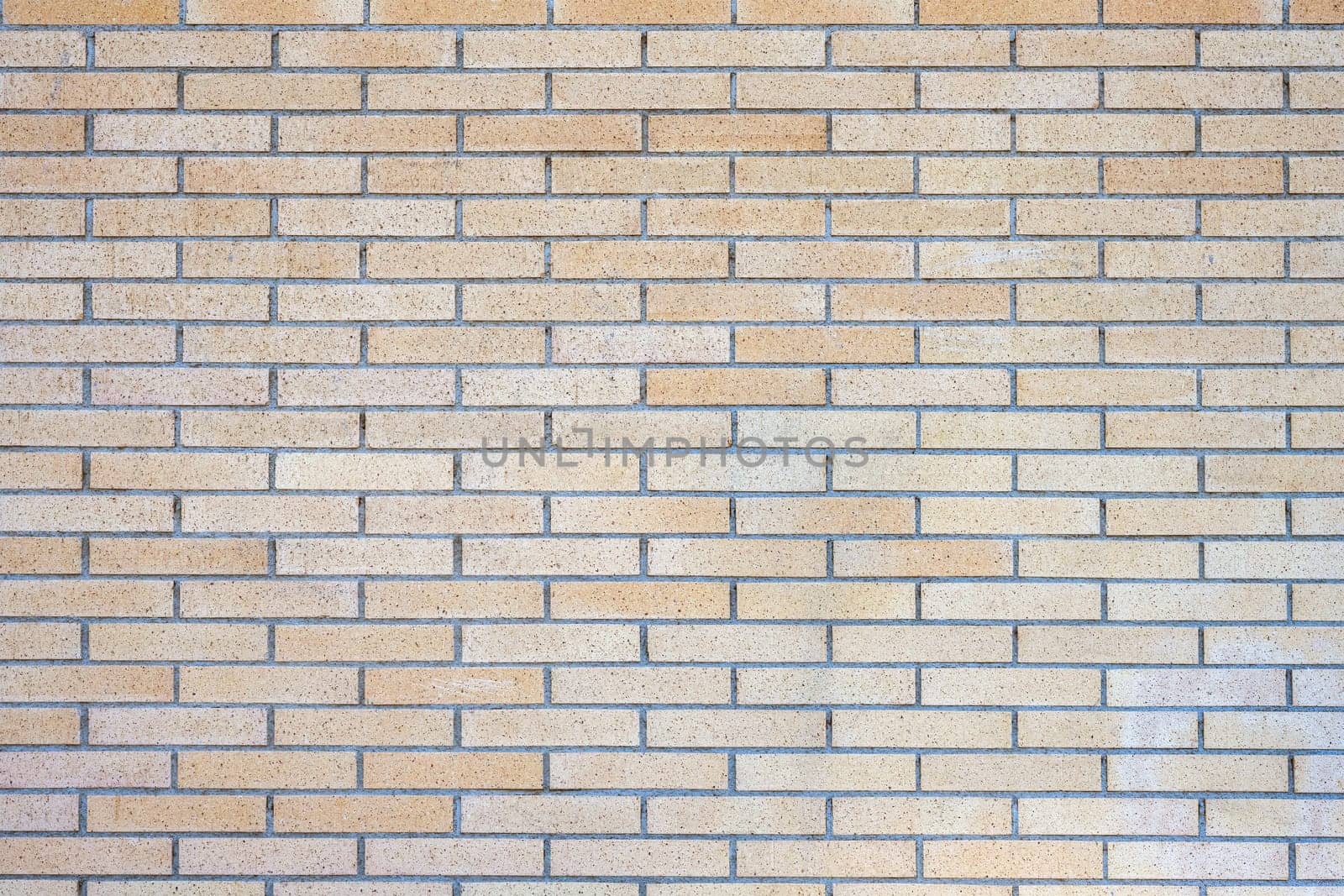 Background from a beige clinkered wall
