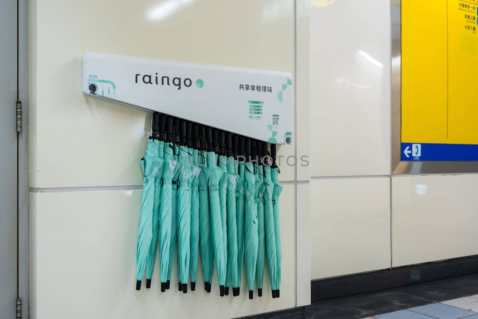 Taipei, Taiwan 26 November 2023: Shared umbrellas "Raingo"" placed outside the MRT station"