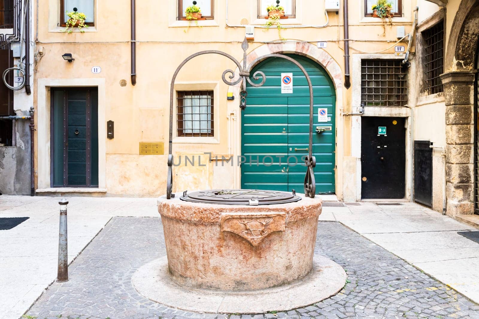 Verona, Italy - July 2022: the famous Well of Love, romantic sightseeing in the heart of the city