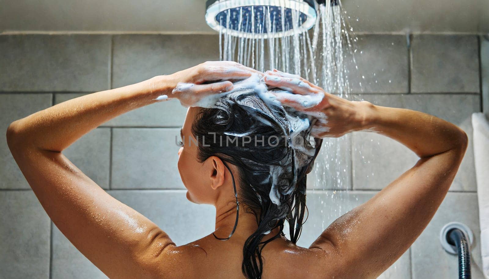 Woman washing his hair in the shower, close-up, rear view. AI generated