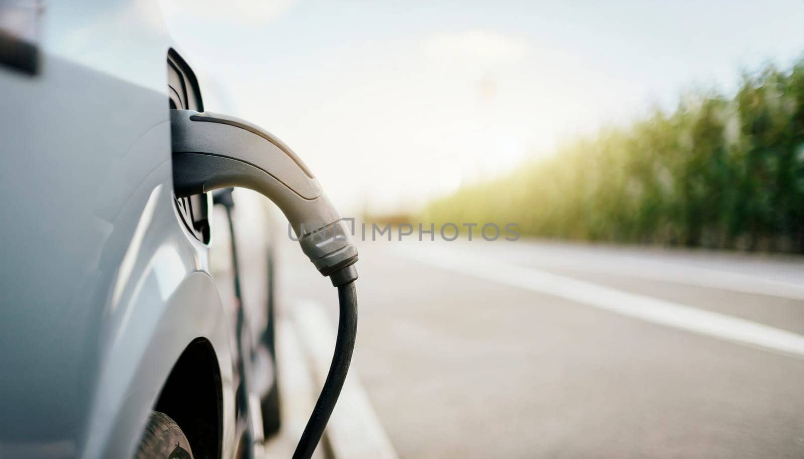 Charging an electric car in the city, closeup of a charging cable. AI generated