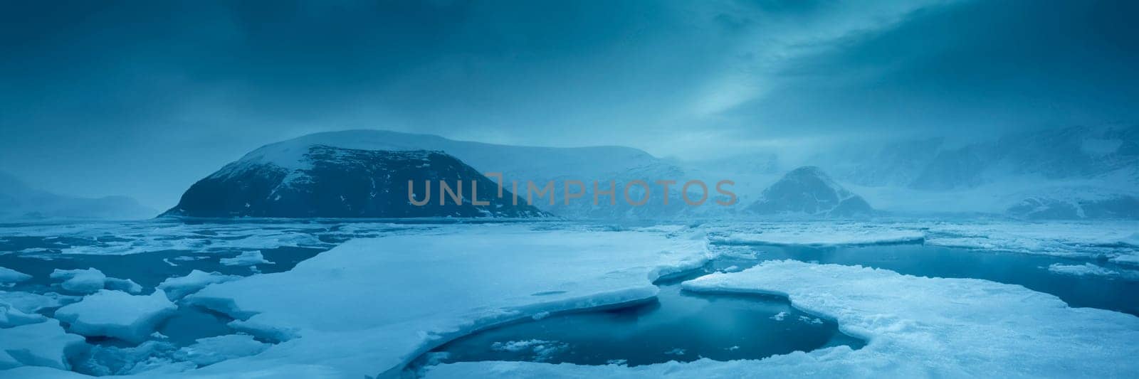 Beautiful winter landscape with icebergs and mountains in Antarctica. AI generated