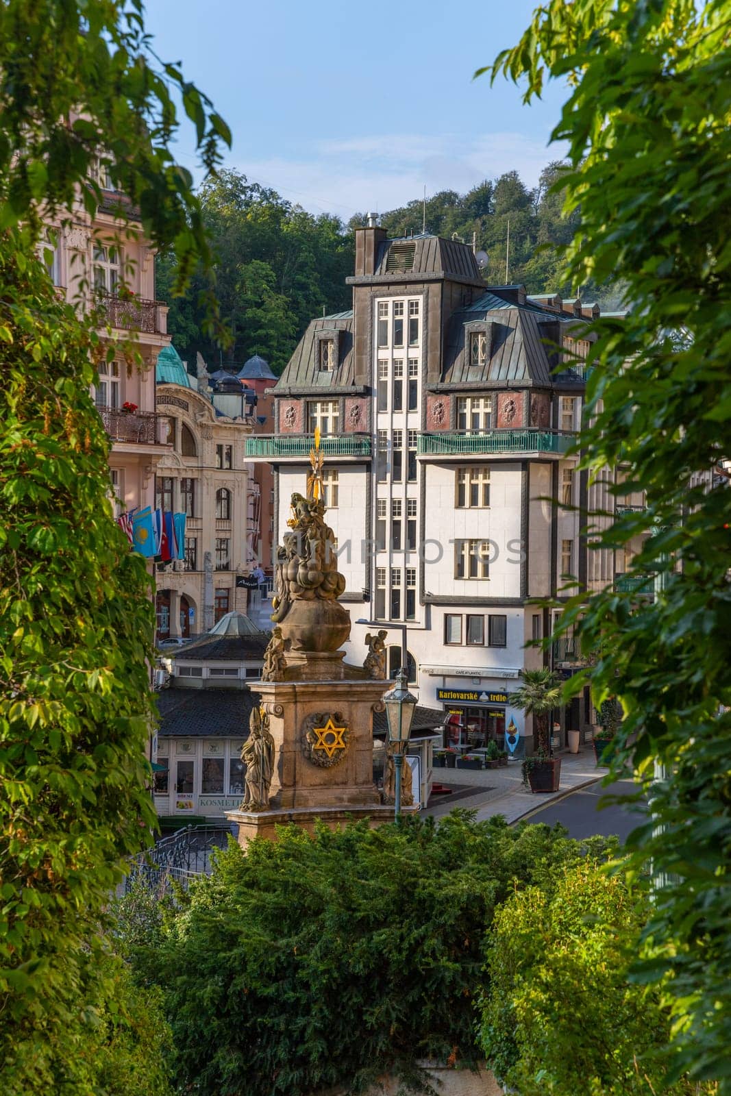 Karlovy Vary, Czech Republic: August 7, 2023. View of street with colorful riverfront houses in Czech famous spa city. Romantic architecture of Bohemia. Urban scene