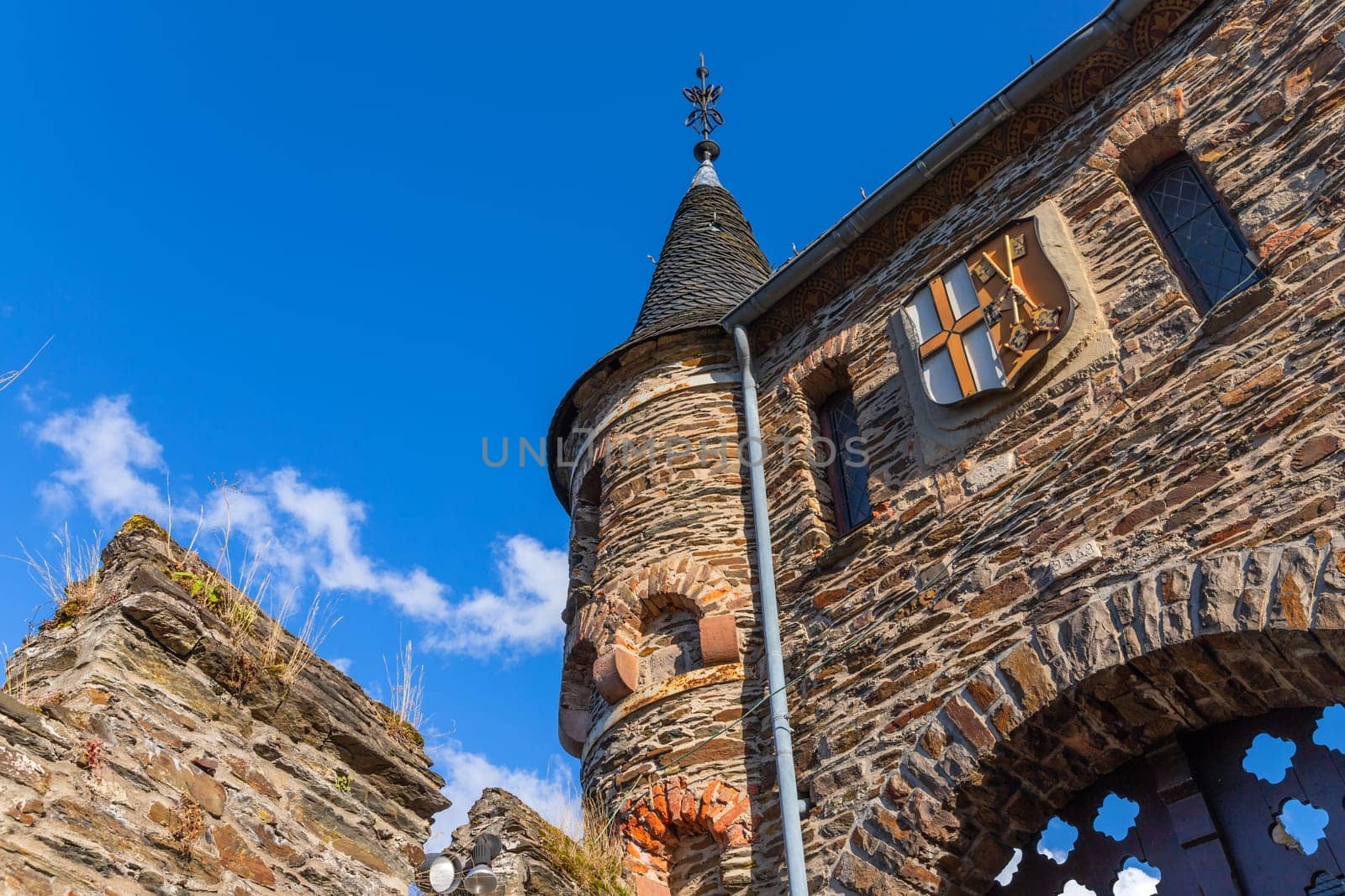 Cochem, Germany, August 10, 2023. Beautiful detail of the hilltop castle (Reichsburg Cochem) in the touristic town of Cochem on the Moselle River in Rhineland-Palatinate in Germany.