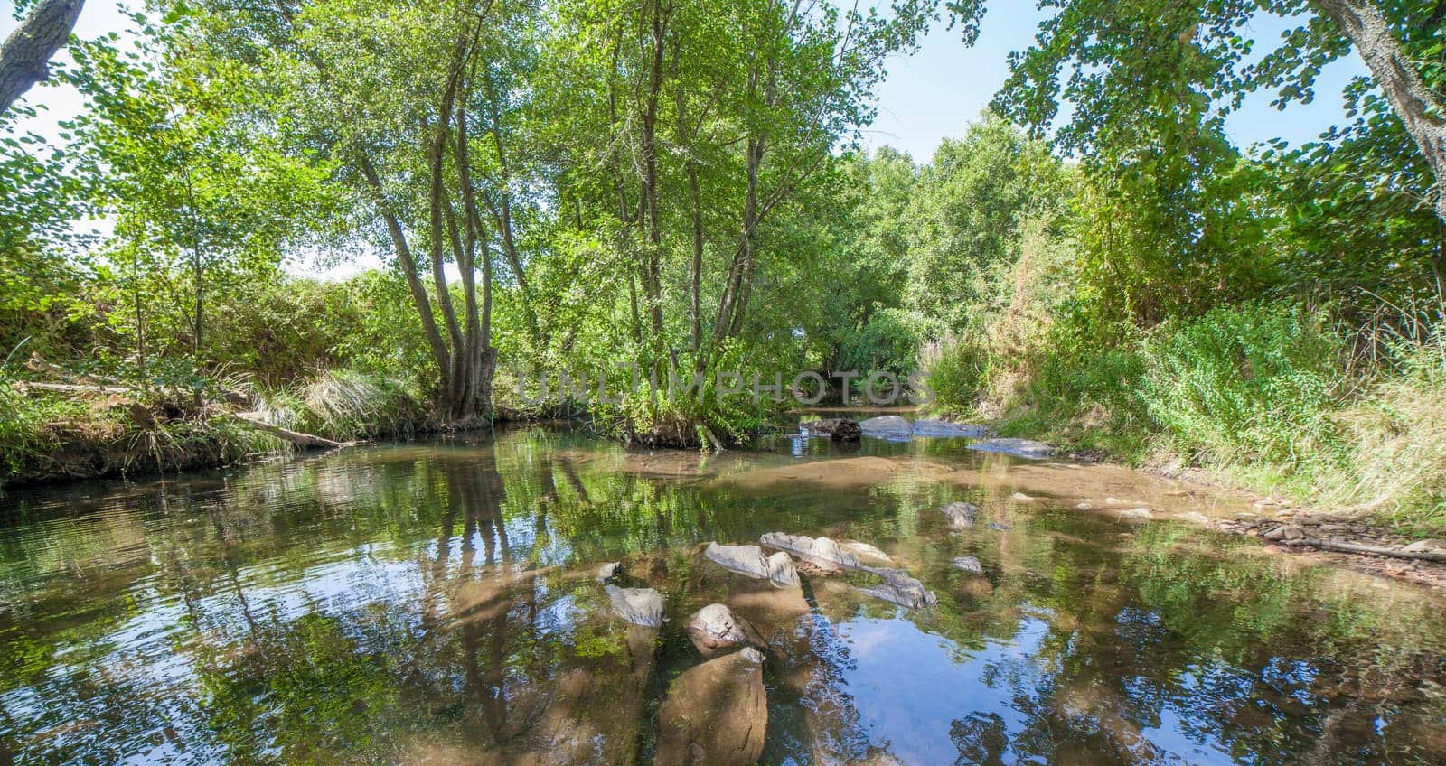 Gevora rocky riverbed, La Codosera, Badajoz, Extremadura, Spain. Idyllic location of crystal clear waters and riverside forests