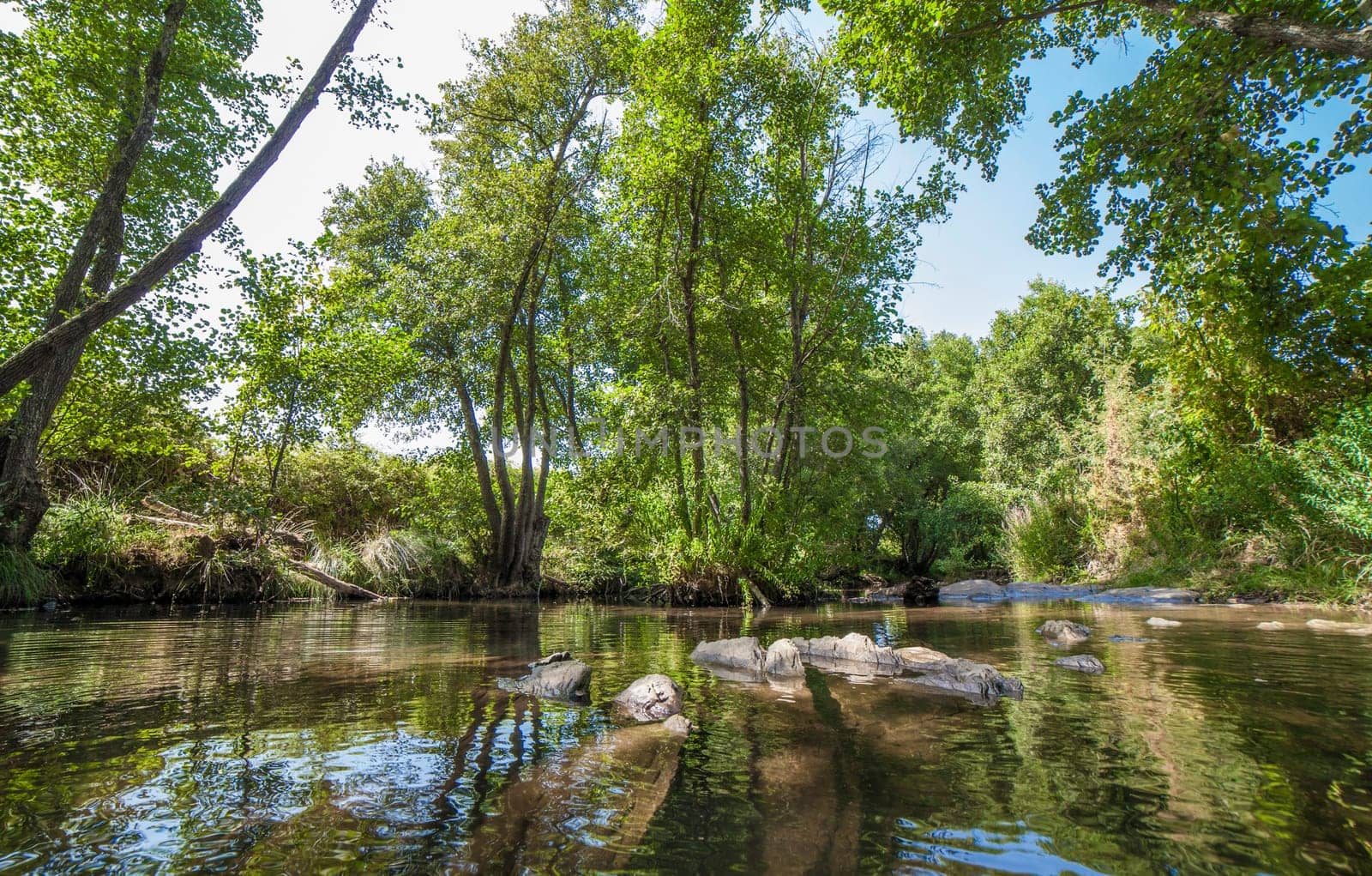 Gevora rocky riverbed, La Codosera, Badajoz, Extremadura, Spain. Idyllic location of crystal clear waters and riverside forests
