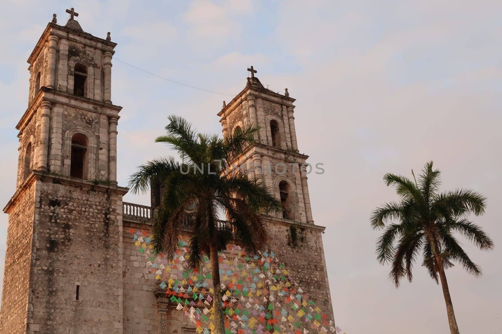 The San Servacio Church, Templo de San Servacio colorfully decorated and surrounded by palmtrees, Valladolid, Mexico 2022