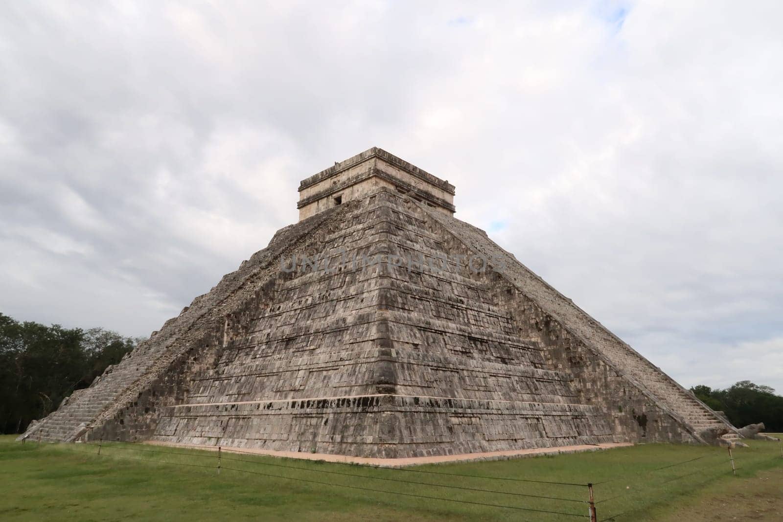 The Kukulcan Pyramid, El Castillo, The Castle at Chichen Itza, View on the intact front and its destroyed side, close to Valladolid, Mexico 2022