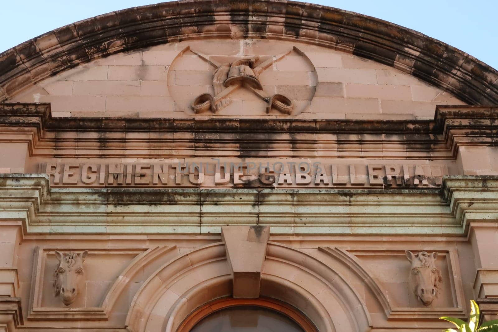 The facade of the building that now houses the botanical garden of Oaxaca, former Regimiento de Caballeria/Cavalry Regiment, Mexico 2022