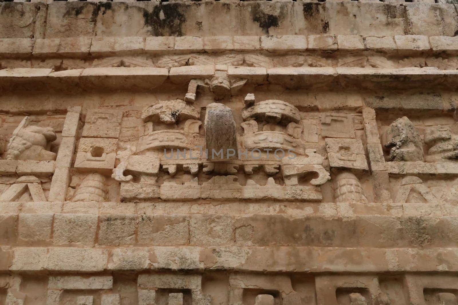 Elaborate facade of the Nunnery Complex, the Nuns house, showing mayan mask face, Chichen Itza, Valladolid, Mexico 2022