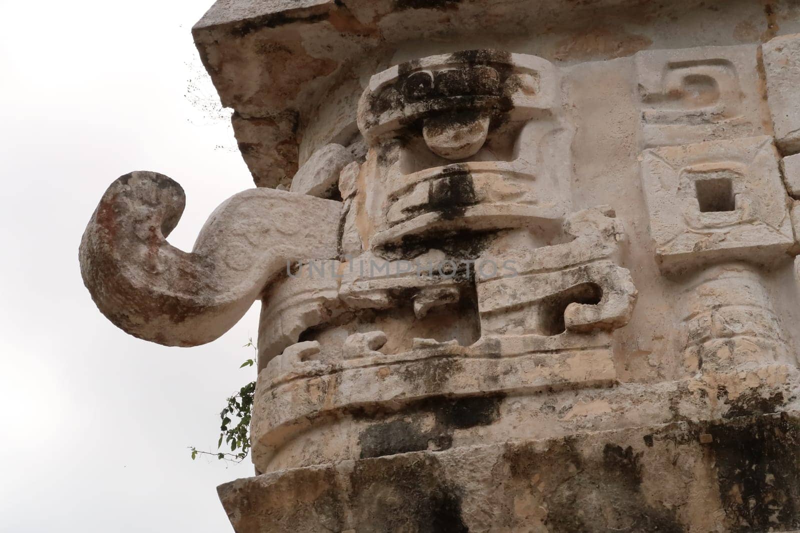 Typical mayan mask face on the edge of the facade of The Church, La Iglesia at Chichen Itza, close to Valladolid, Mexico 2022