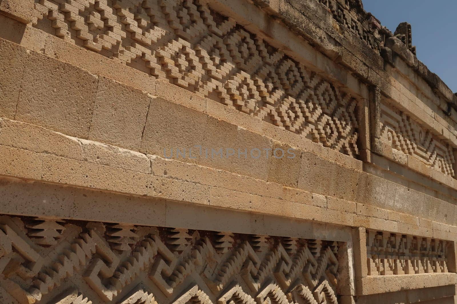 Many patterns and shapes on one of the outer walls of The Palace/Grand Hall of Columns, at the archaeological site of Mitla, Oaxaca, Mexico 2022