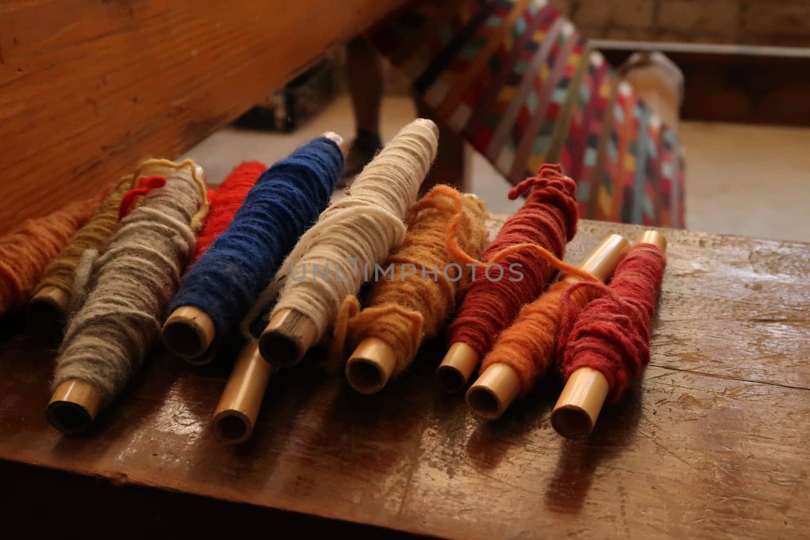 Colorful threads at a traditional carpet weaving workshop, Oaxaca, Mexico 2022