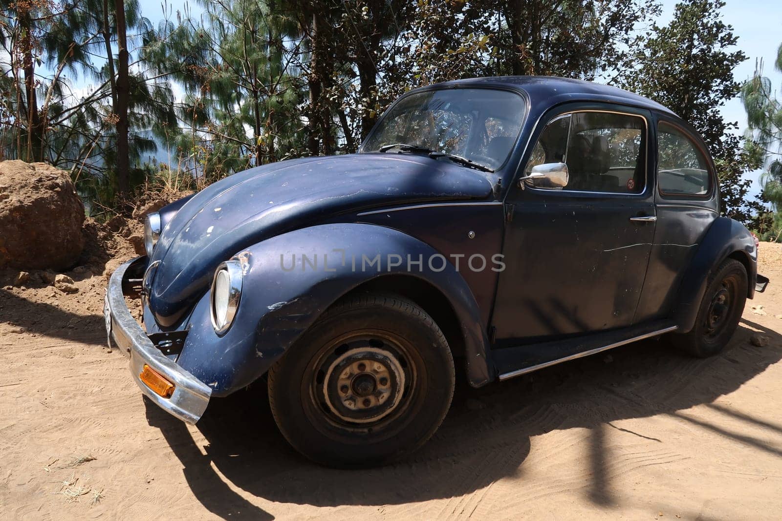 Old car parked on a sandy road leading from San Jose del Pacifico to San Mateo Rio Hondo, Oaxaca, Mexico 2022