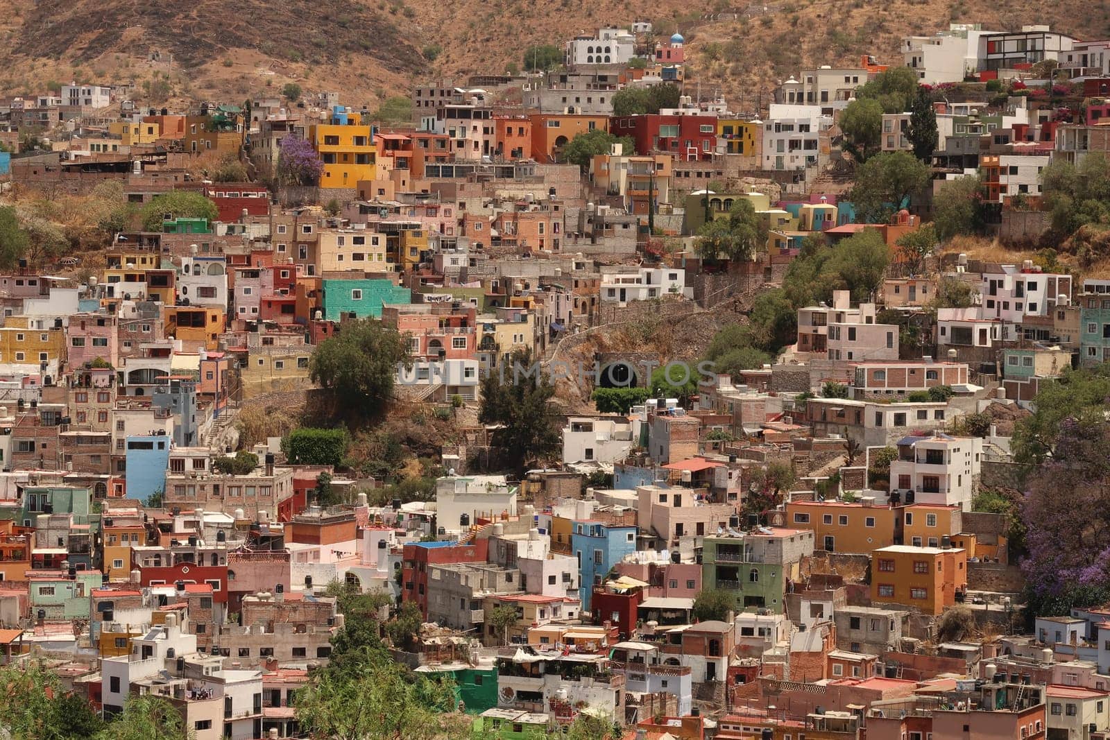 View onto a neighbourhood in Guanajuato with its colorful houses and an entrance to its famous tunnel system, Mexico 2022