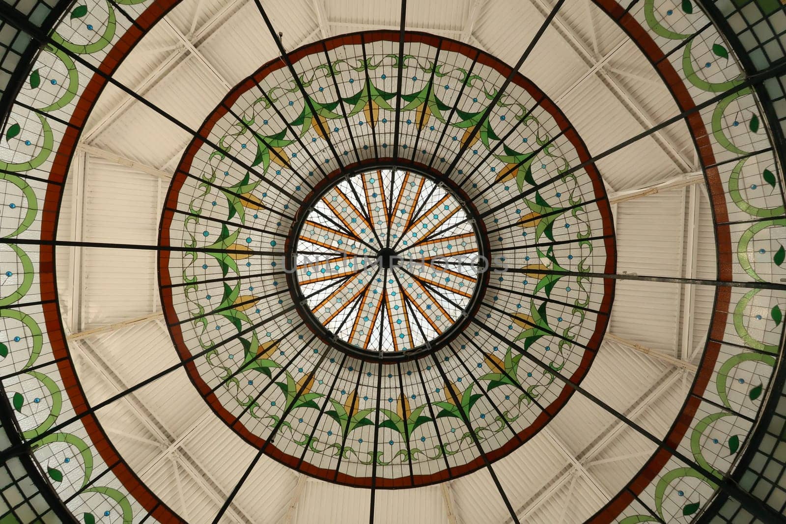 The colorful glass roof/copola of the Quiosco de la rosa de los vientos in the La Victoria Market, Mercado de La Victoria, Puebla, Mexico 2022
