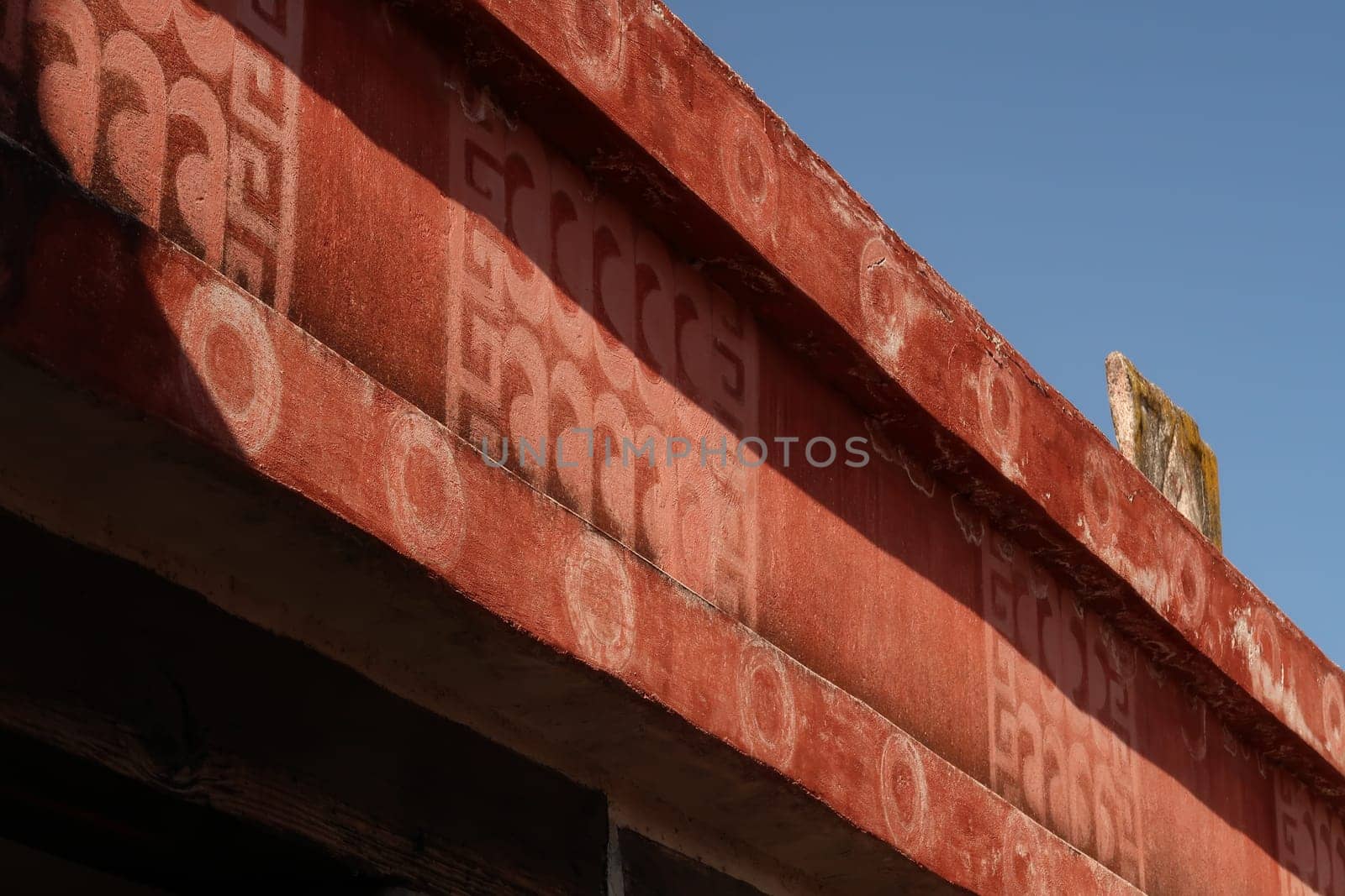 Red painted elements with patterns/symbols in the Quetzalpapálotl Palace/Palacio de Quetzalpapálotl at Teotihuacan, Mexico City 2022